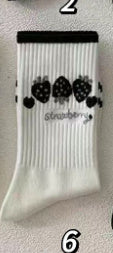 Charming Black Strawberry Mid-Calf Socks with Playful Japanese Butterfly Whirl