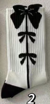 Charming Black Strawberry Mid-Calf Socks with Playful Japanese Butterfly Whirl